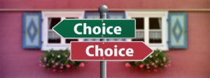 2 road signs pointing opposite direction saying Choice