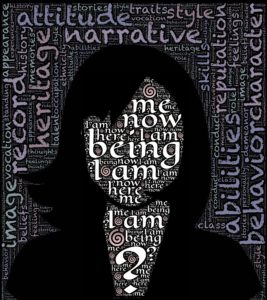 woman outline and face and background covered in words like heritage and narrative