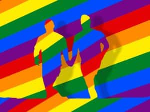 rainbow colored graphic with two men holding hands