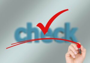 The work check in blue with a red check mark with a red line under it