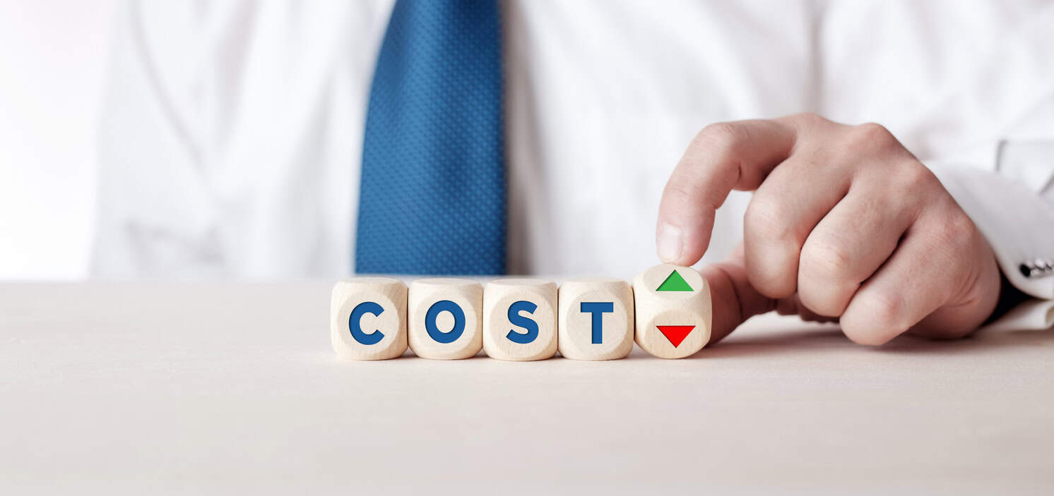 Businessman turning a wooden cube with the arrows
